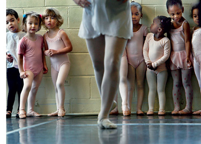 Photograph of girls looking at dancing legs